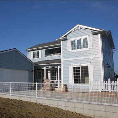 淡いブルーラップサイディング